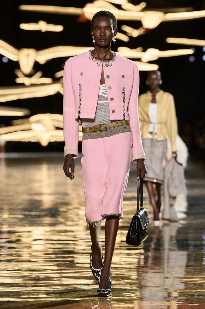 Candy pink tweed jacket and pencil skirt with a chain belt, Chanel S/S 27, Paris.