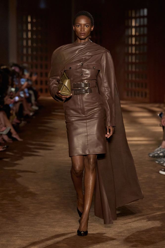Chocolate leather belted dress under a long draped cape, Ferragamo S/S 27, Milan.