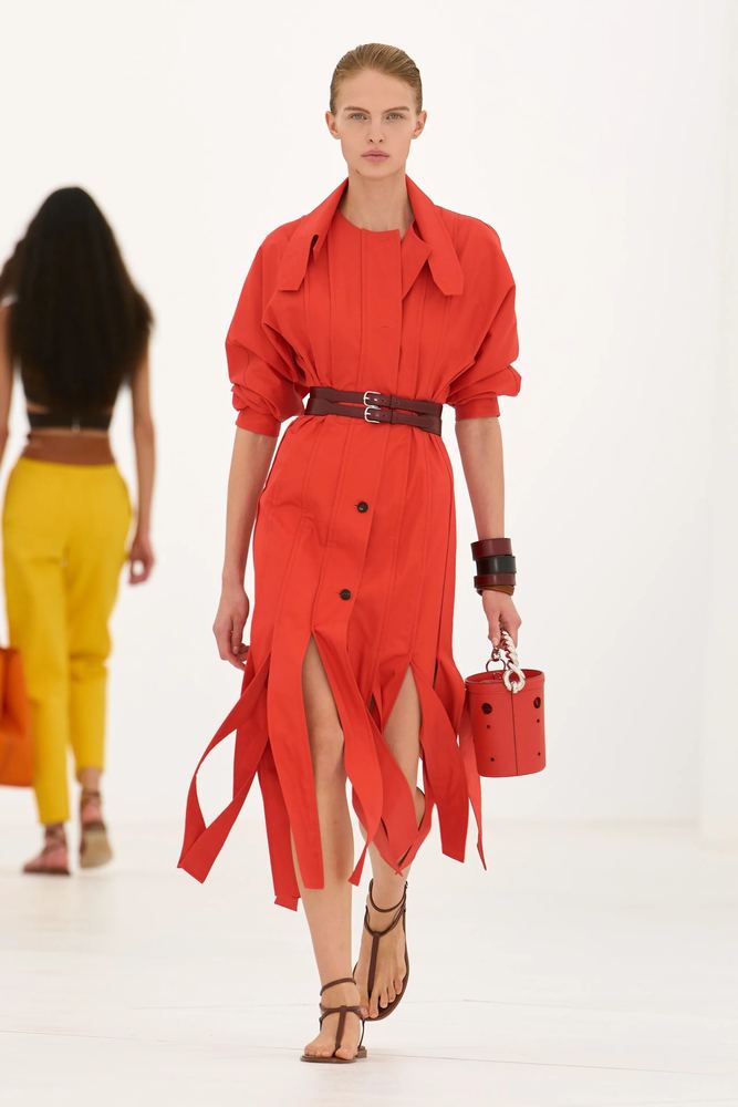 Tangerine shirt dress with a slashed ribbon hem and a wide leather belt, Hermès S/S 27, Paris.