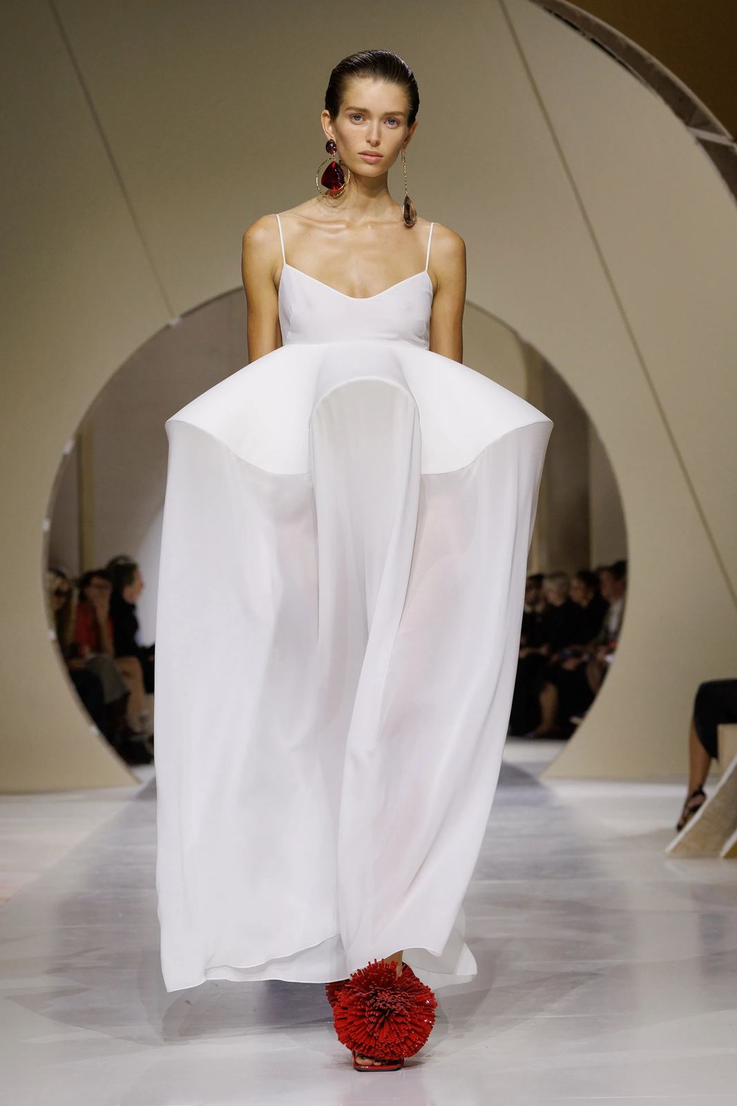 White organza gown with a sculpted, architectural peplum skirt, Givenchy S/S 27, Paris.